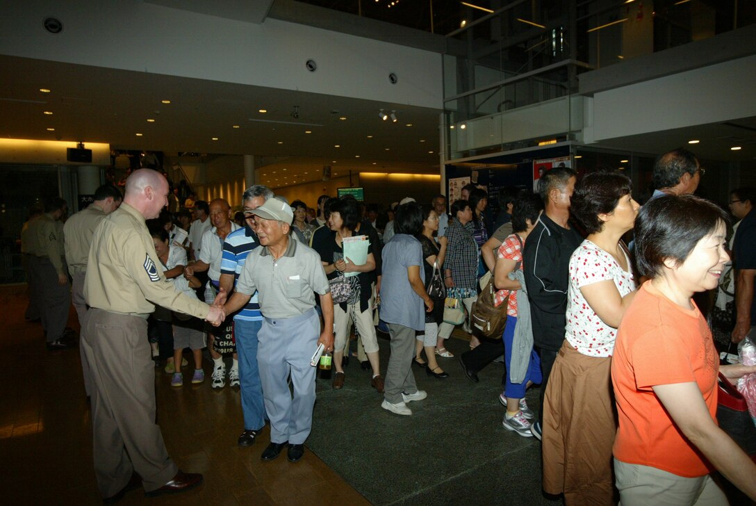 SENDAI, JAPAN --MSgt Vinnie Dublino greets audience members after an AF Band of the Pacific-Asia performance, Sep 2011. (courtesy photo)