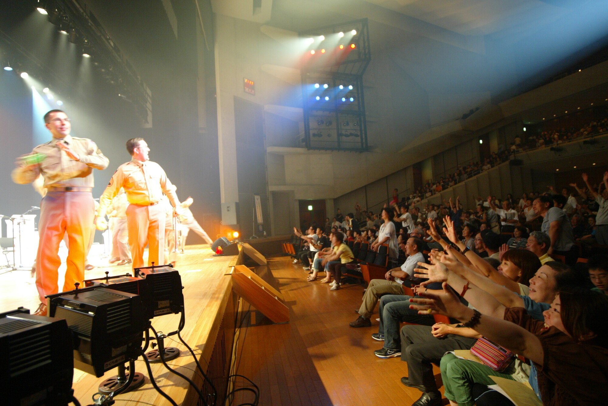 SENDAI, JAPAN--After the show, band members toss autographed souvenirs to audience members in the Sendai area, Sep 2011. (courtesy photo)