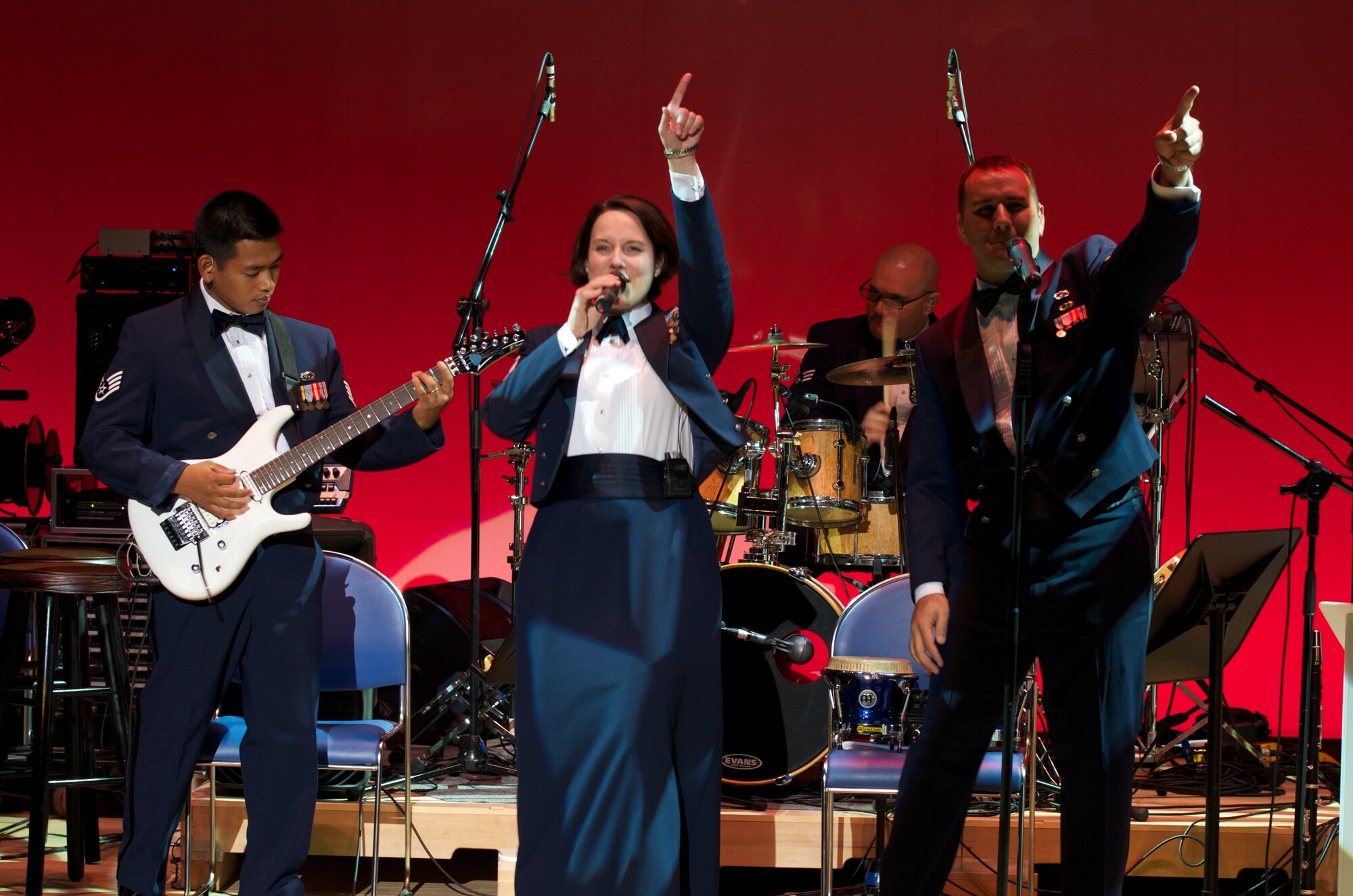 MIYAGI, JAPAN--MSgt Paula Goetz and SrA William Pressgrove sing an energetic opener for 1200 people in Misato town, Miyagi Prefecture.  Sep 2011  (courtesy photo)