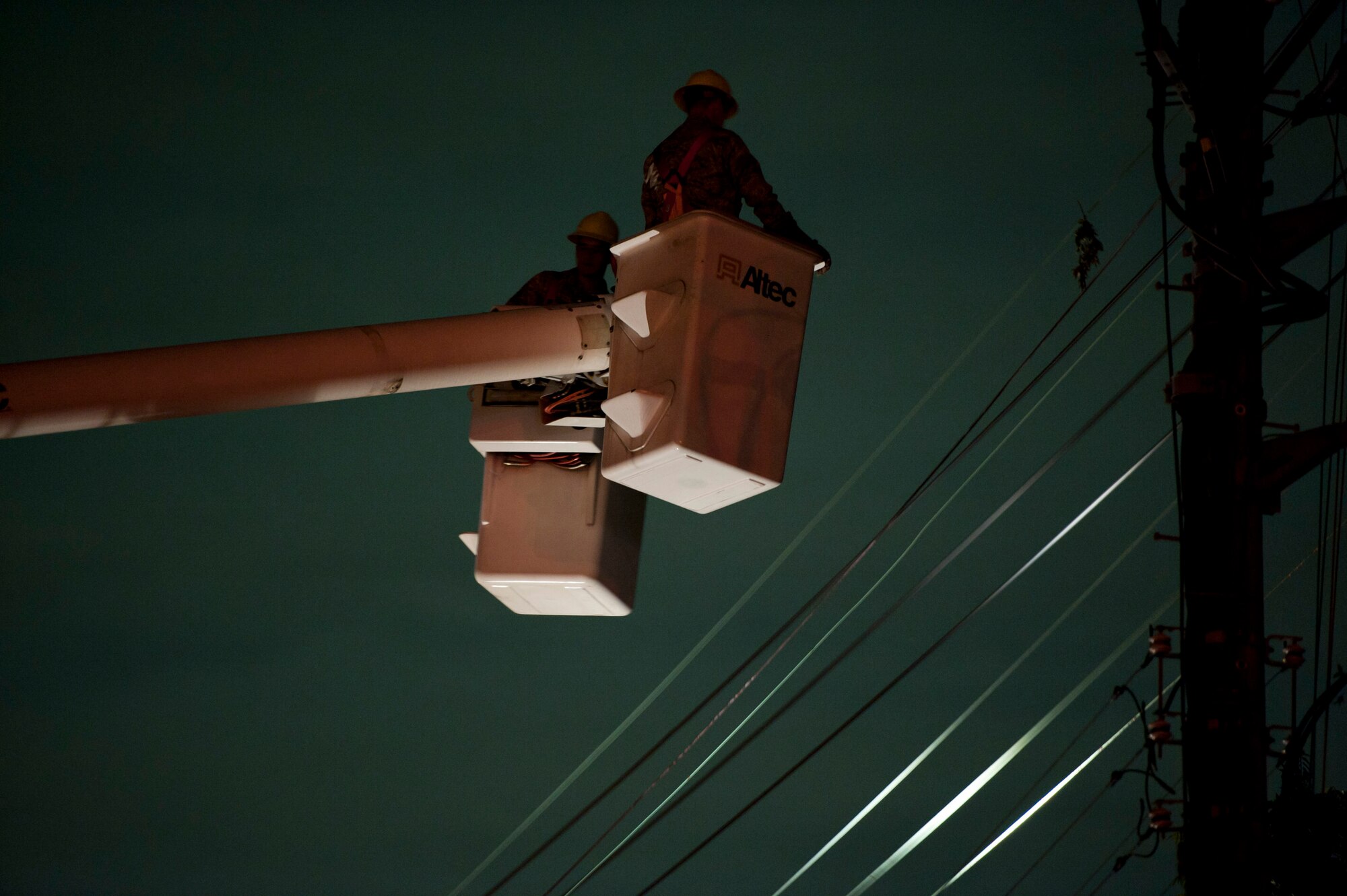 YOKOTA AIR BASE, Japan -- Electricians from the 374th Civil Engineer Squadron fix a downed power line after Tropical Storm Roke hit Sep. 21, 2011, at Yokota Air Base, Japan. (U.S. Air Force photo/Staff Sgt. Samuel Morse)