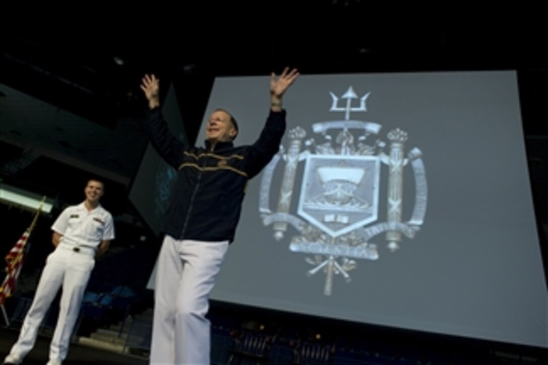 U.S. Navy Adm. Mike Mullen, chairman of the Joint Chiefs of Staff thanks the midshipmen after receiving a gift from Midshipman 1st Class Jonathan Monti (left), U.S. Naval Academy brigade commander, at the Forrestal Lecture Series in Annapolis, Md., on Sept. 21, 2011.  The series began in 1970 and draws representatives from various walks of life to enhance the education, awareness and appreciation of the Brigade of Midshipmen. 