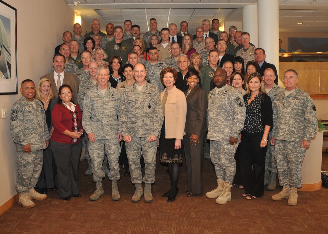 Offutt AIR FORCE BASE, Neb. - U.S. Strategic Command's top leadership welcomed their spouses to the Component Commanders and Spouses Conference Sept. 22.  Gen. C. Robert Kehler, USSTRATCOM commander, is joined in the front row by Gen. William Shelton, Air Force Space Command commander, in addition to Chief Master Sgt. Raul Ruiz, USSTRATCOM first sergeant; Command Sergeant Major Patrick Alston, USSTRATCOM senior enlisted leader; and Maj. Gen. William Grimsley, USSTRATCOM chief of staff; and their spouses.