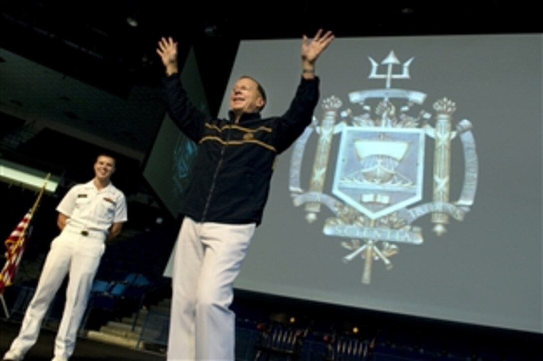 Navy Adm. Mike Mullen, chairman of the Joint Chiefs of Staff, thanks the midshipmen after receiving a gift from Midshipman 1st Class Jonathan Monti, left, Naval Academy brigade commander, during the Forrestal Lecture Series in Annapolis, Md., Sept. 21, 2011. The series began in 1970 and draws representatives from various walks of life to enhance the education, awareness and appreciation of the Brigade of Midshipmen. DOD photo by U.S. Navy Petty Officer 1st Class Chad J. McNeeley