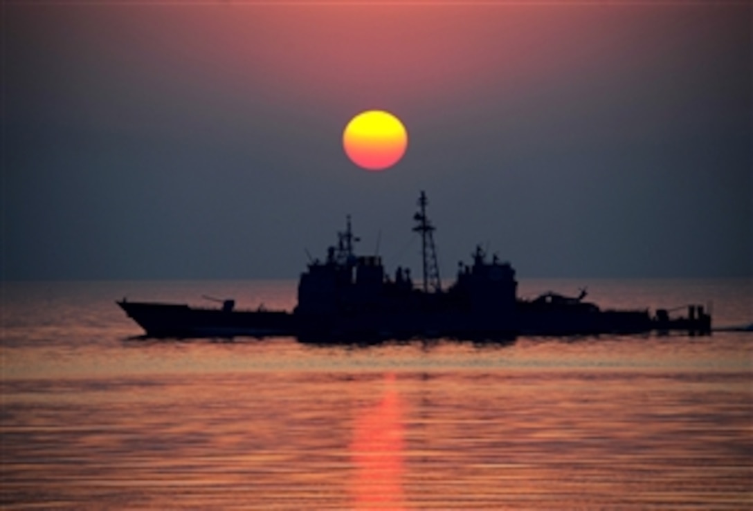 The Ticonderoga-class guided-missile cruiser USS Mobile Bay (CG 53) operates in the Persian Gulf on Sept. 20, 2011.  The Mobile Bay is deployed to the U.S. 5th Fleet area of responsibility conducting maritime security operations and support missions as part of Operations Enduring Freedom and New Dawn