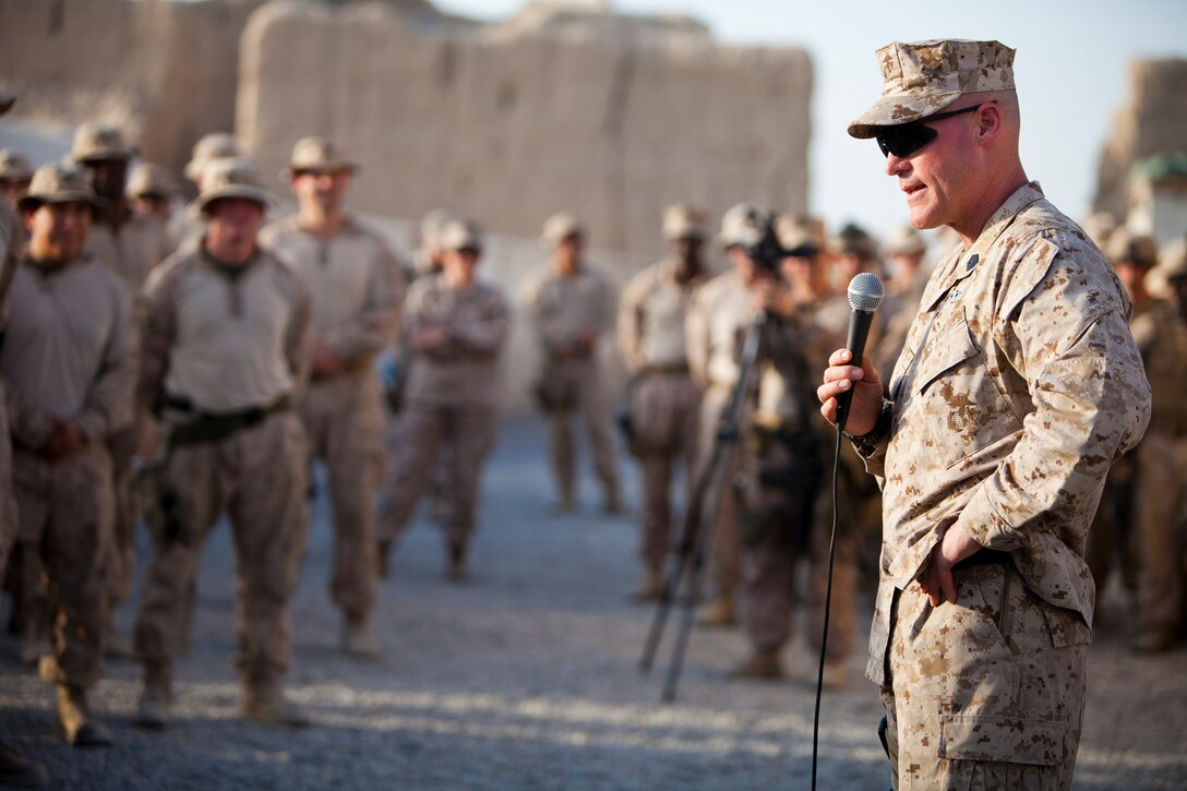 The 17th Sergeant Major of the Marine Corps Sgt. Maj. Micheal P. Barrett, addresses Marines assigned to 2nd Light Armored Reconnaissance Battalion at Combat Outpost Kahn Neshin, Helmand province, Afghanistan, Sept. 22, 2011. Sgt. Maj. Barrett along with General James F. Amos, the 35th Commandant of the Marine Corps, traveled to Afghanistan to visit deployed service members throughout Regional Command (Southwest) and speak about recent events.