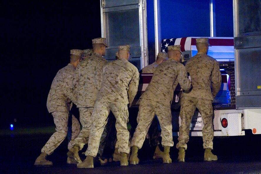 A U.S. Marine Corps carry team transfers the remains of Marine Lance Cpl. Terry C. Wright of Scio, Ohio, at Dover Air Force Base, Del., Sept. 23, 2011. Wright was assigned to 1st Battalion, 6th Marine Regiment, 2nd Marine Division, II Marine Expeditionary Force, Camp Lejeune, N.C. (U.S. Air Force photo/Adrian Rowan)