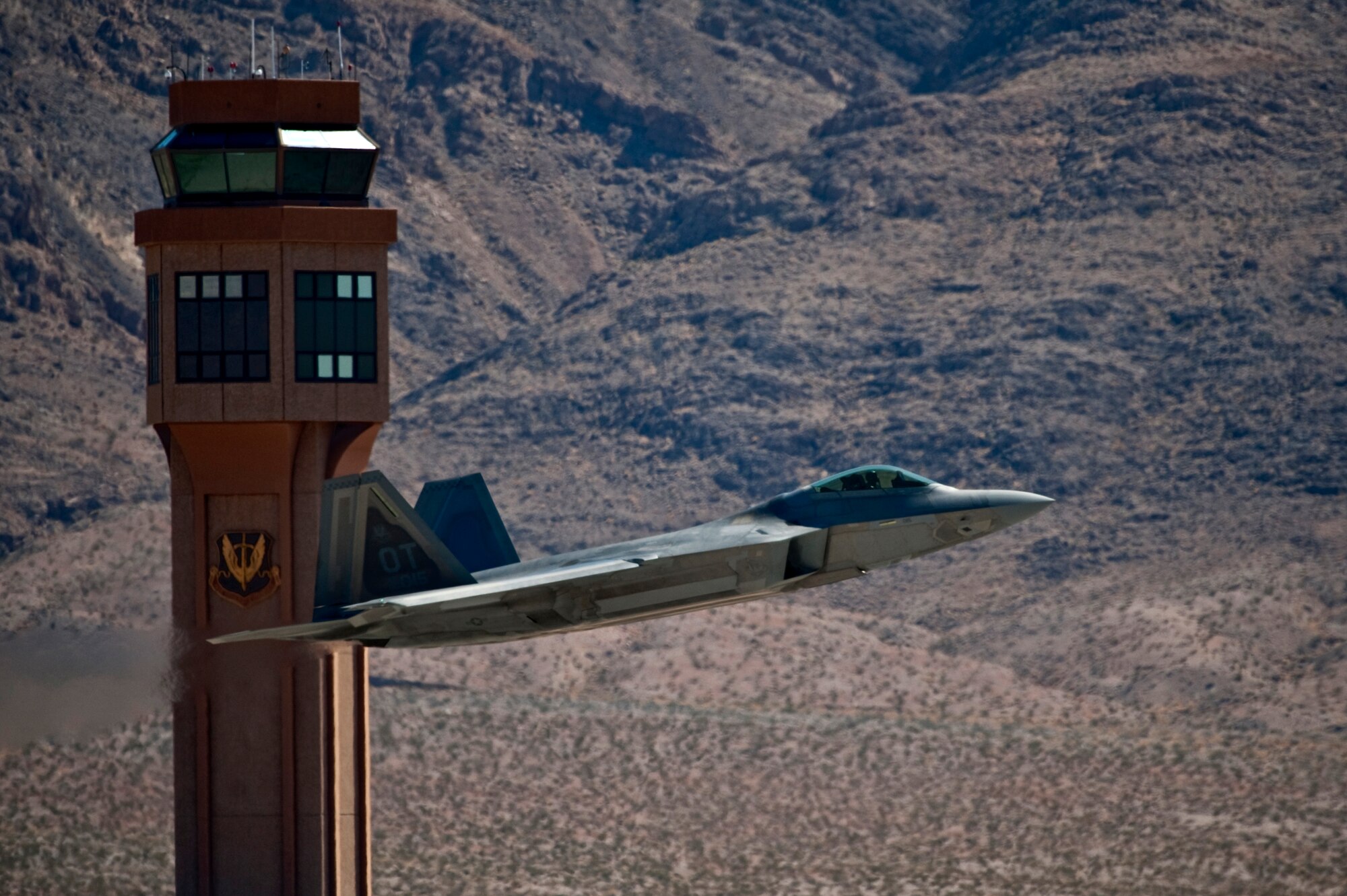 A U.S. Air Force F-22 Raptor takes off Sept. 21, 2011, at Nellis Air Force Base Nev. The flight was the first since an Air Combat Command directed stand-down of the entire F-22 fleet May 3, 2011. The Raptors were grounded as a safety precaution, following 12 separate reported incidents where pilots experienced hypoxia-like symptoms. Officials remain focused on the priorities of aircrew safety and combat readiness. The return-to-fly plan implements several risk-mitigation actions, to include rigorous inspections, training on life-support systems and continued data collection. (U.S. Air Force photo by Tech. Sgt. Michael R. Holzworth/Released)
