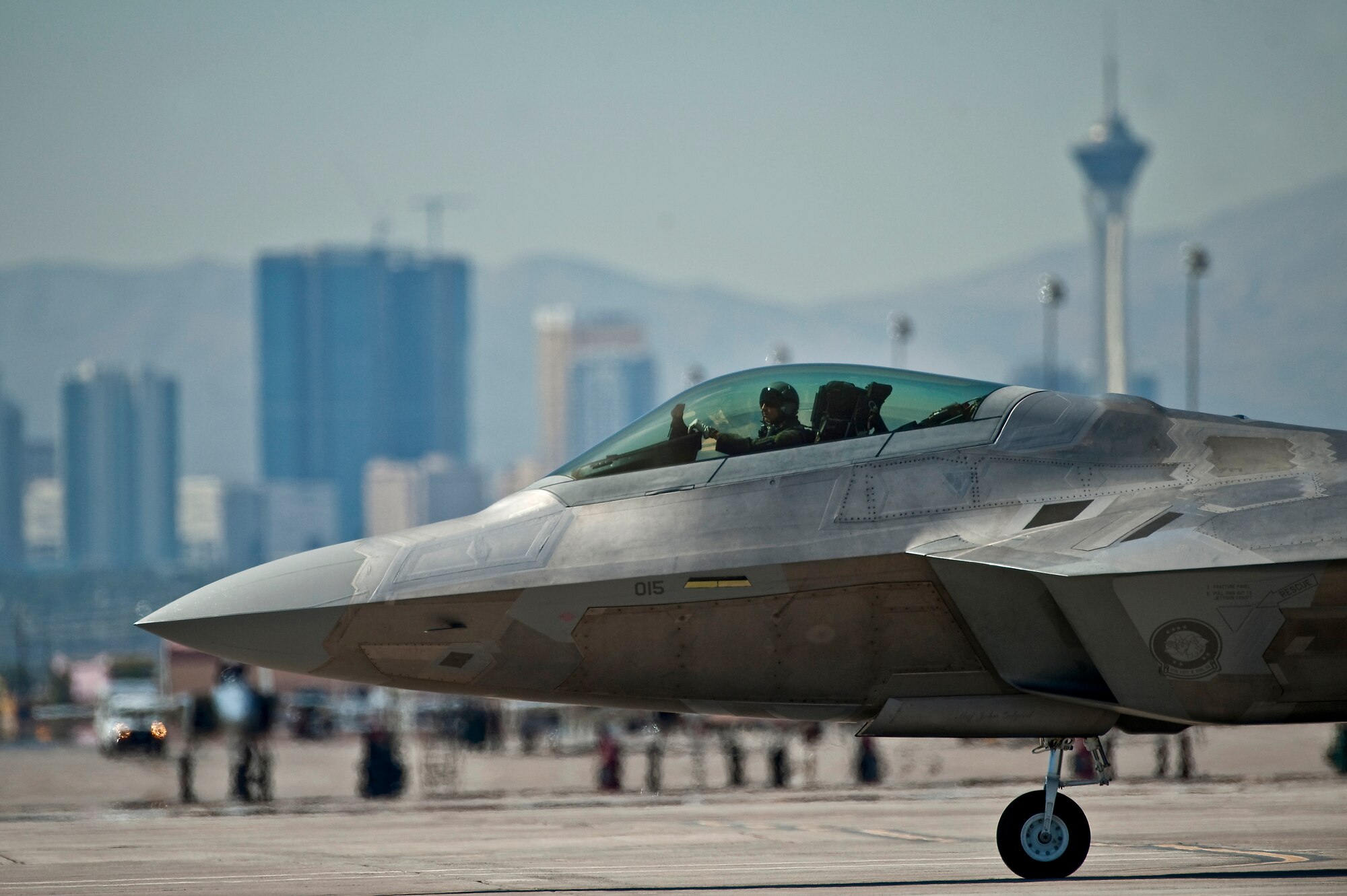 A U.S. Air Force F-22 Raptor taxis toward the runway Sept. 21, 2011, at Nellis Air Force Base Nev., for its first flight since an Air Combat Command directed stand-down of the entire F-22 fleet May 3, 2011. The Raptors were grounded as a safety precaution, following 12 separate reported incidents where pilots experienced hypoxia-like symptoms. Officials remain focused on the priorities of aircrew safety and combat readiness. The return-to-fly plan implements several risk-mitigation actions, to include rigorous inspections, training on life-support systems and continued data collection. (U.S. Air Force photo by Tech. Sgt. Michael R. Holzworth/Released)

