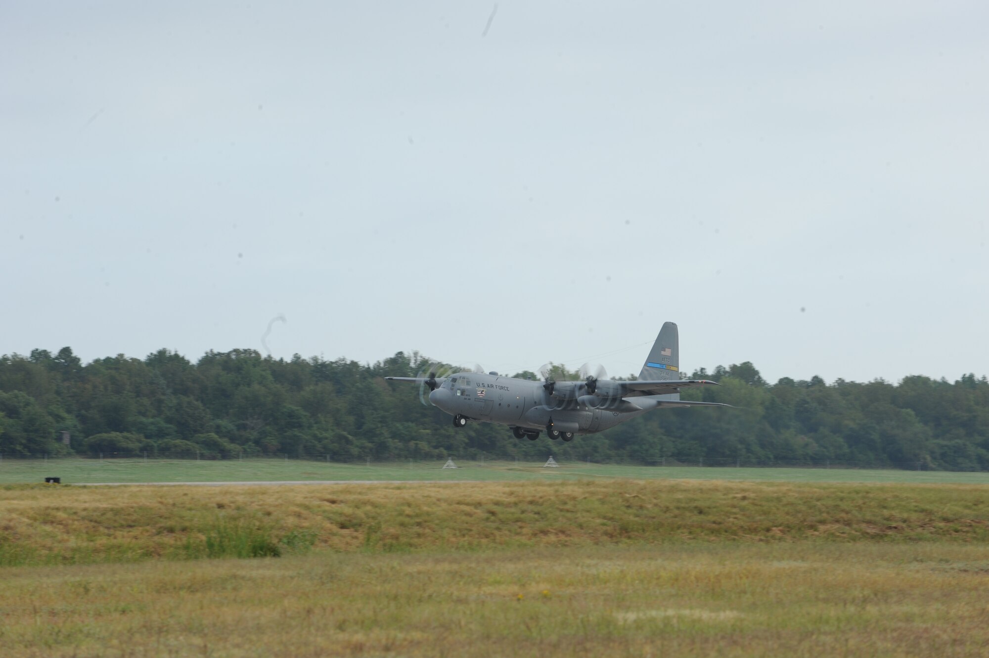 C-130E 62-1855, assigned to the 314th Airlift Wing, churns air as it takes off from the Little Rock Air Force Base, Ark., runway for the last time, Sept. 20, 2011.  Tail 62-1855 delivery to the 309th Aerospace Maintenance and Regeneration Group at Davis-Monthan Air Force Base, Ariz., marked the end of a 47-year relationship between the 314th AW and the C-130E.  (U.S. Air Force photo by Staff Sgt. Jim Araos).