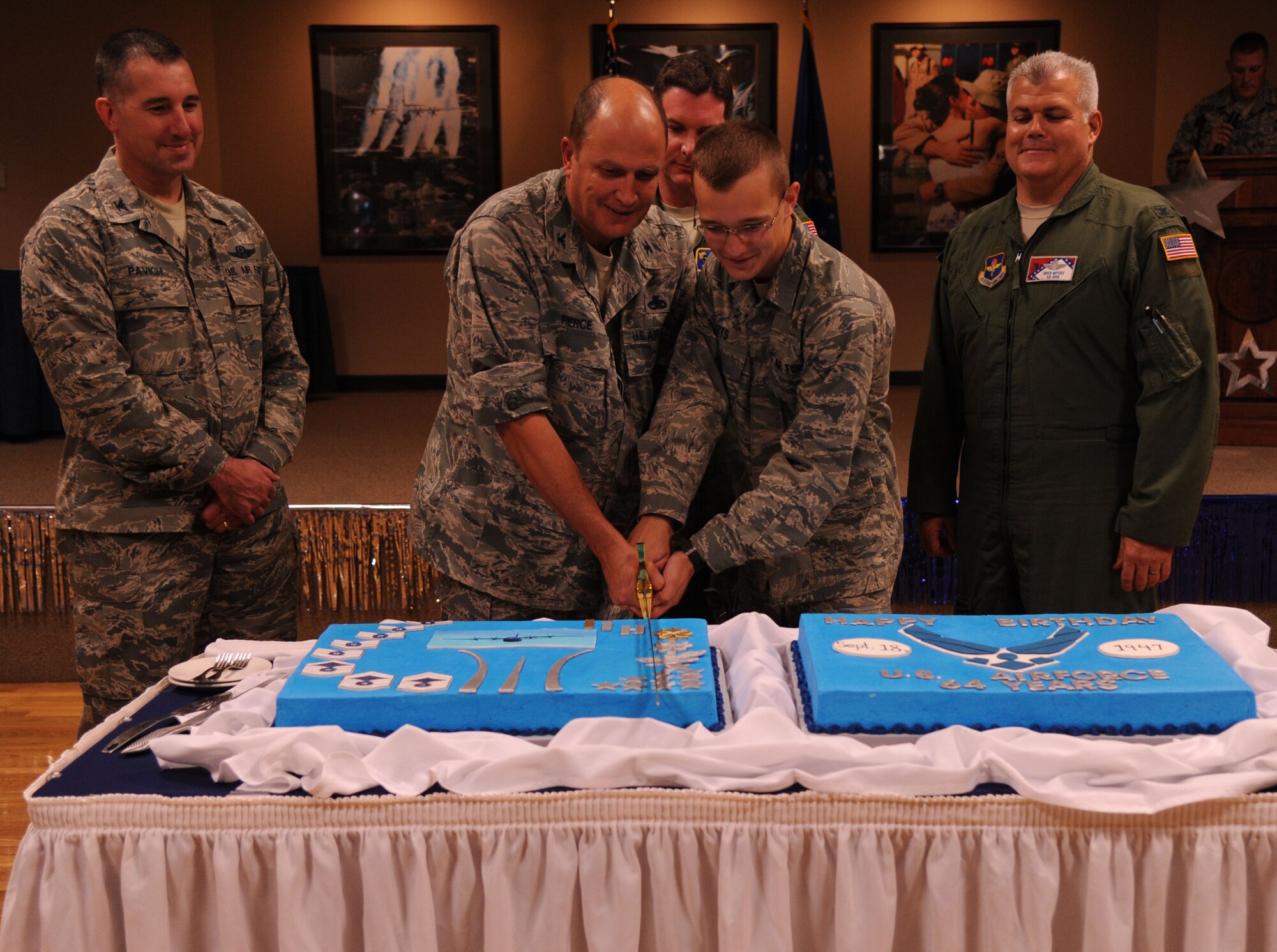 Team Little Rock members celebrated the Air Force’s 64th birthday at Hangar 1080 this afternoon. The Air Force's birthday was Sept. 18, but base officials decided to combine the birthday celebration with the 19th Airlift Wing's Wingman Day today. Cutting the cake (from left to right) were Col. Todd Pavich, 314th Airlift Wing vice commander; Col. Mike Pierce, 19th Maintenance Group commander; Col. Tom Crimmins, 19th Airlift Wing vice commander, Airman Basic Willy Pitts, 19th Aerospace Medical Squadron; and Col. Greg Myers, 189th Operations Group commander. Pierce is the longest serving active-duty member on base, serving since 1972, and Pitts is the newest active-duty member, joining the Air Force in April 2011. (U.S. Air Force Photo by Airman 1st Class Kaylee Clark)