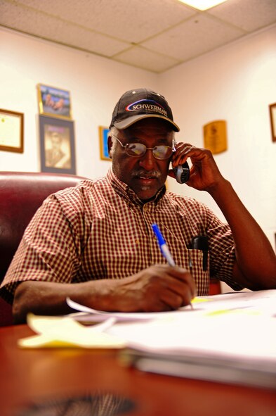 Houston Smith, 7th Logistics Readiness Squadron, chief of cargo movement,  answers a phone call Sept. 22, 2011 at the Traffic Management Office at Dyess Air Force Base, Texas. TMO’s inbound section unloads, sorts and distributes incoming materials to Dyess. (U.S. Air Force photo by Airman 1st Class Peter Thompson/ Released)