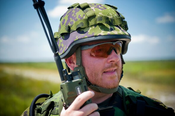 Danish army Capt. Jessper Larsen, training leader, listens in on a radio transmission during Exercise Atlantic Strike 11-02 at Avon Park Air Force Range, Fla., Sept. 14, 2011. During the exercise, Larsen acted as a ground commander and helped train new U.S. Air Force joint terminal attack controllers. This was his fourth time participating in Atlantic Strike. Larsen said he enjoys training new JTACs and seeing them grow. (U.S. Air Force photo by Staff Sgt. Jamal D. Sutter/Released) 