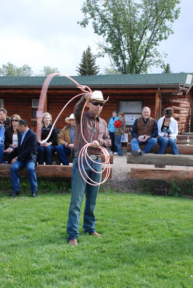 Col. Tom Wilcox, 90th Security Forces Group commander, prepares to lasso a “steer” during the Military Affairs Committee barbecue at Frontier Park Sept. 17. (U.S. Air Force photo by Capt. Angela Webb)