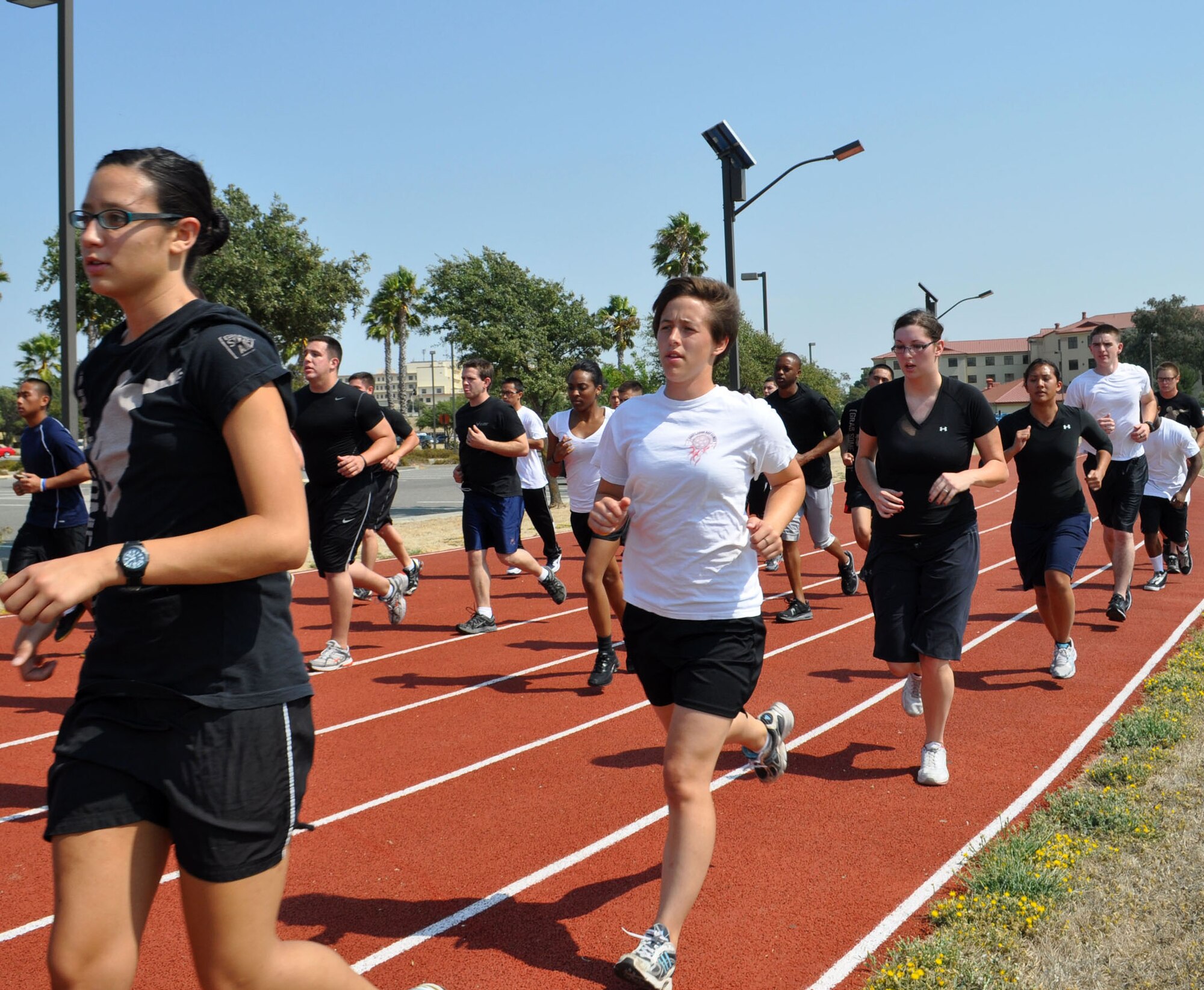 TRAVIS AIR FORCE BASE, Calif. -- Future Air Force reservists get in their first physical training run on the Travis AFB track Sept. 10. These trainees are in the delayed enlistment program for basic military training. Five test case training flights have been stood up at various bases, to help better prepare them for the rigors of BMT and technical training schools. (U.S. Air Force photo/Senior Airman Amelia M. Leonard)