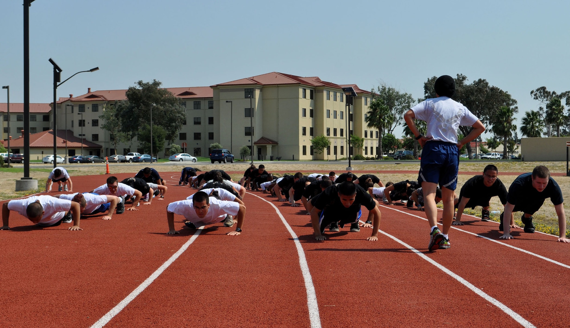 TRAVIS AIR FORCE BASE, Calif. -- Future Air Force reservists hit their physical training hard on the Travis track Sept. 10th. While in delayed enlistment, these trainees are getting the jump on their learning curve in a new Training Flight stood up at the 349th Air Mobility Wing here. One of five test flight locations, the 349th is trying to better prepare them for the rigors of basic military training and technical training schools before they get there. (U.S. Air Force photo/Senior Airman Amelia M. Leonard)