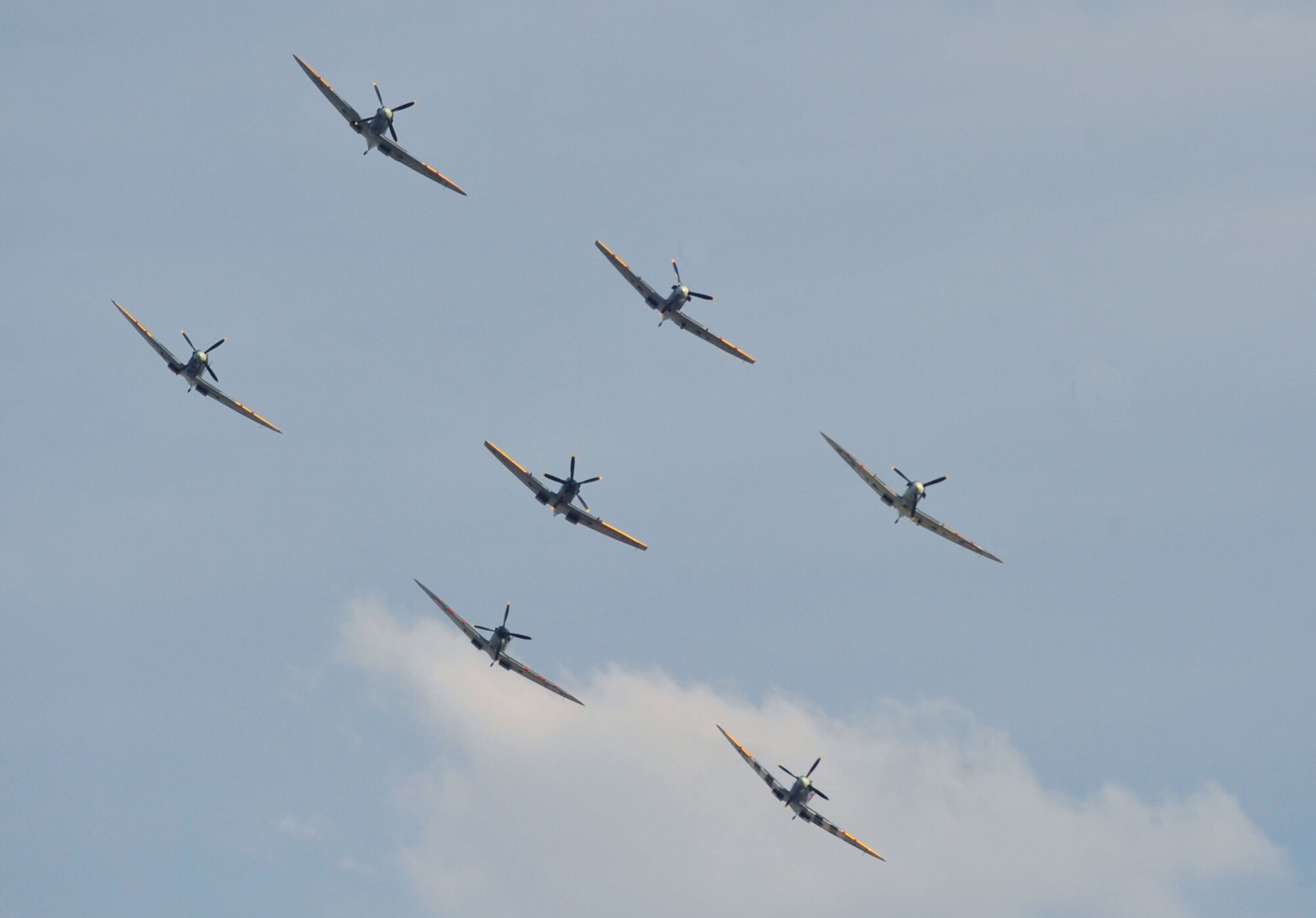 A formation of Supermarine Spitfires entertains an audience during the Duxford Air Show Sept. 3, 2011 in Duxford village in Cambridgeshire, England. Duxford was home of an airfield used by the U.S. Army Air Force during WWII to launch attacks on the axis powers. (U.S. Air Force photo by Senior Airman Marissa Tucker)