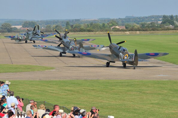 The world’s largest formation of Supermarine Spitfire aircraft taxie down the runway during the Duxford Air Show, at a village in Cambridgeshire, England, Sept. 3, 2011. The Supermarine Spitfire was the only allied aircraft in production throughout the duration of the war. Today, a replica of the aircraft stands outside the Spitfire Pub here on Seymour Johnson Air Force Base, N.C., in honor of those who gave their lives during the Battle of Britain. (U.S. Air Force photo by Senior Airman Marissa Tucker)