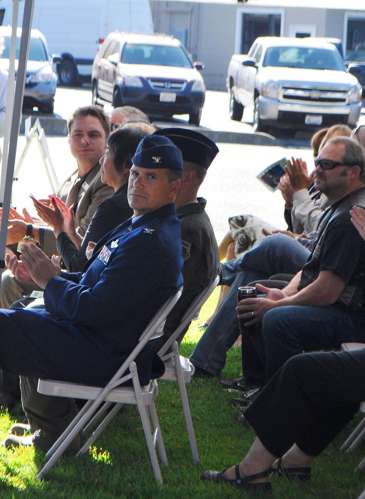 TRAVIS AIR FORCE BASE, Calif. --Col. Al Lupenski watches as the Travis Air Force Base Honor Guard prepares for the POW/MIA table of honor ceremony Sept. 16, 2011, in Vacaville, Calif. Col. Lupenski, 349th Operations Group commander, attended the city's National POW/MIA Recognition Day ceremony with other base commanders and Travis Airmen to honor the 83,000 still unaccounted for, since World War II through the Cold War. (U.S. Air Force photo/Senior Master Sgt. Ellen L. Hatfield)