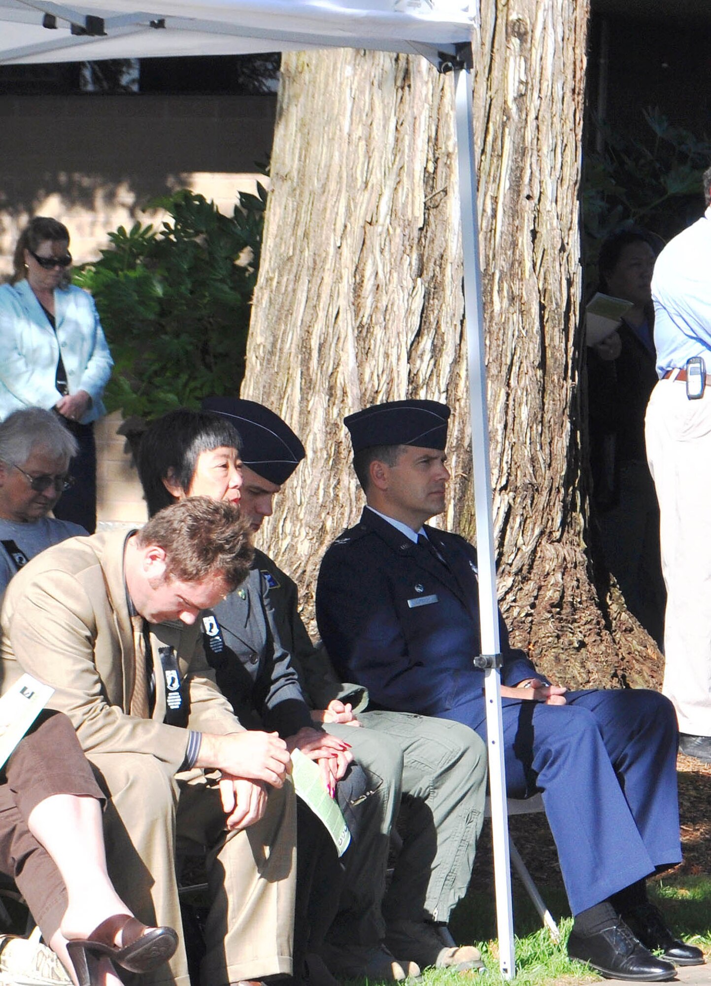 TRAVIS AIR FORCE BASE, Calif. --Col. Al Lupenski, right, 349th Operations Group commander, listens to a presentation Sept. 16, 2011, at the Vacaville National POW/MIA Recognition Day ceremony. This day is observed so the nation never forgets the more than 83,000 prisoners of war/missing in action, still unaccounted for, since World War II. Guest speaker for the event was Mel Raimundo, a former POW held for more than five months in Stalag 48 in Germany, during World War II. (U.S. Air Force photo/Senior Master Sgt. Ellen L. Hatfield)