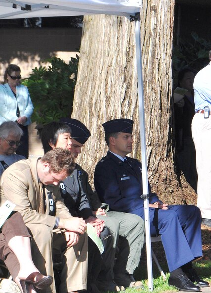 TRAVIS AIR FORCE BASE, Calif. --Col. Al Lupenski, right, 349th Operations Group commander, listens to a presentation Sept. 16, 2011, at the Vacaville National POW/MIA Recognition Day ceremony. This day is observed so the nation never forgets the more than 83,000 prisoners of war/missing in action, still unaccounted for, since World War II. Guest speaker for the event was Mel Raimundo, a former POW held for more than five months in Stalag 48 in Germany, during World War II. (U.S. Air Force photo/Senior Master Sgt. Ellen L. Hatfield)