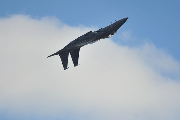 Major Mike Maedor, F-15E- Strike Eagle Demo Team captain, performs an upside down maneuver showcasing the capabilities of the F-15E Strike Eagle during the Duxford Air Show, a village in Cambridgeshire, England, Sept 3, 2011. The demo team, along with five pilots and weapons system officers traveled to the United Kingdom to attend the air show, which celebrated 70 years since the formation of the Royal Air Force Eagles Squadrons. What we know today as the 334th, 335th and 336th Fighter Squadrons began in England 70 years ago, as Americans joined the RAF during World War II to help in the fight against the German Luftwaffe before official American entry into the war. (U.S. Air Force photo by Senior Airman Marissa Tucker)