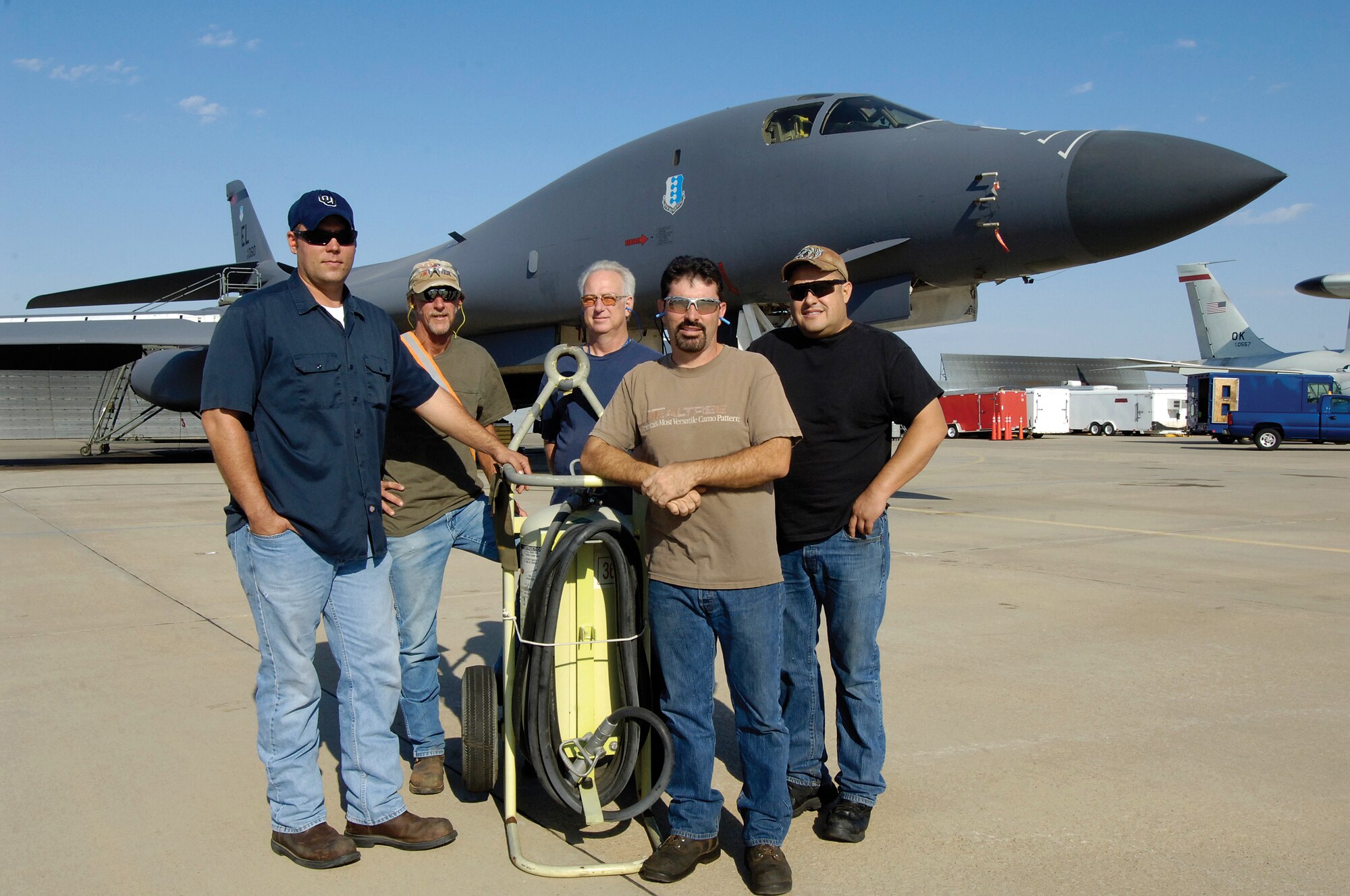 Safety Hero
Tinker 565th Aircraft Maintenance Squadron Post Dock mechanic John Dauria, front right, has all eyes on him for his role in extinguishing a B-1 fire April 11 during testing for a functional check flight. But Mr. Dauria won’t take the credit and insists he and his co-workers were a unified team to save the $283 million aircraft like the one pictured here. With him from left are Scott Mears, electrician; Craig Baumann, avionics; Kenneth Garland, electrician; Mr. Dauria and Jesse Lara, mechanic. On the team that day, but not pictured are Cliff Sneed, Mike Timmer and Steven Cosby.  (Air Force photo by Margo Wright)
