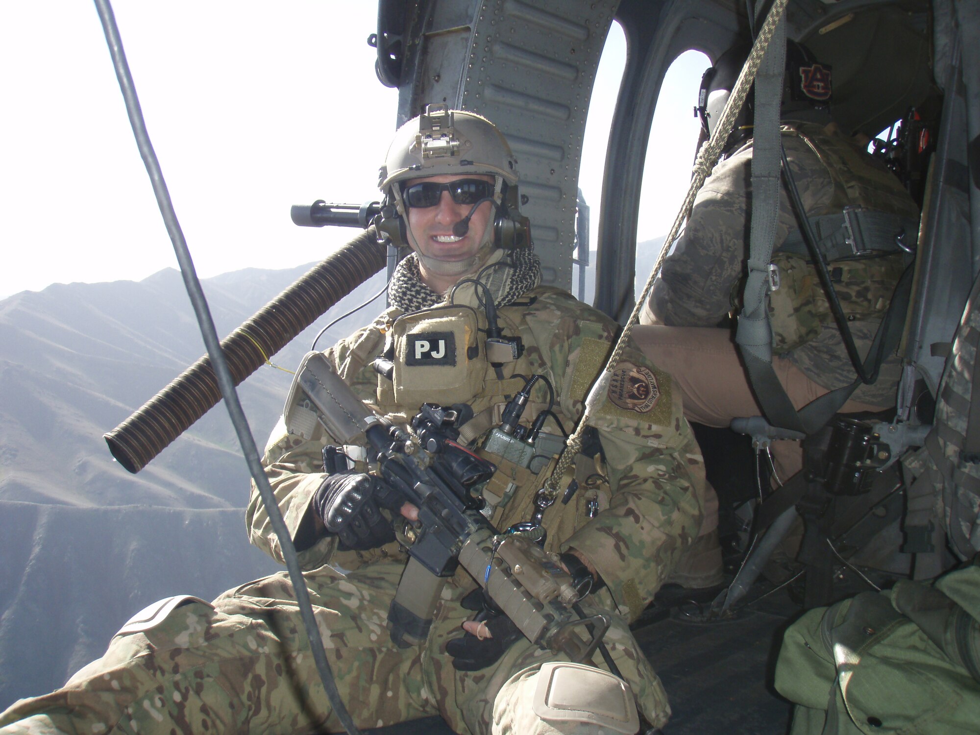 PATRICK AIR FORCE BASE, Fla. - Staff Sgt. Dan Warren, Air Force Reserve pararescueman, flies above the mountains of Afghanistan. Sgt. Warren was part of a Guardian Angel Team who saved 15 lives and helped 49 others to safety after an avalanche devastated a mountain pass in Afghanistan. (U.S. Air Force photo)     