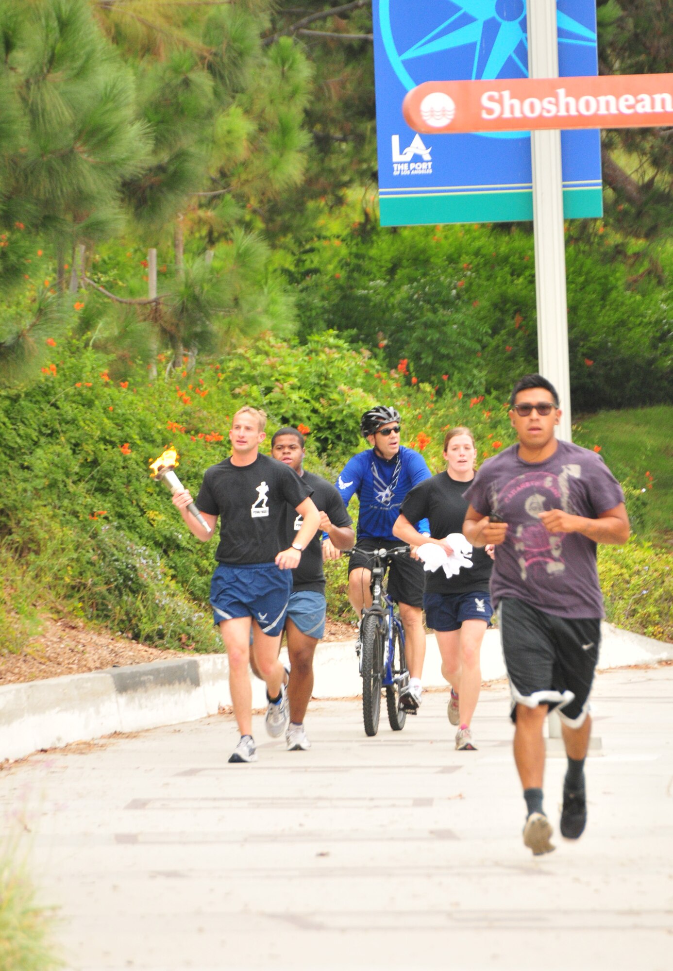 The torch is carried through San Pedro, Sept. 15. (Photo by Lou Hernandez)