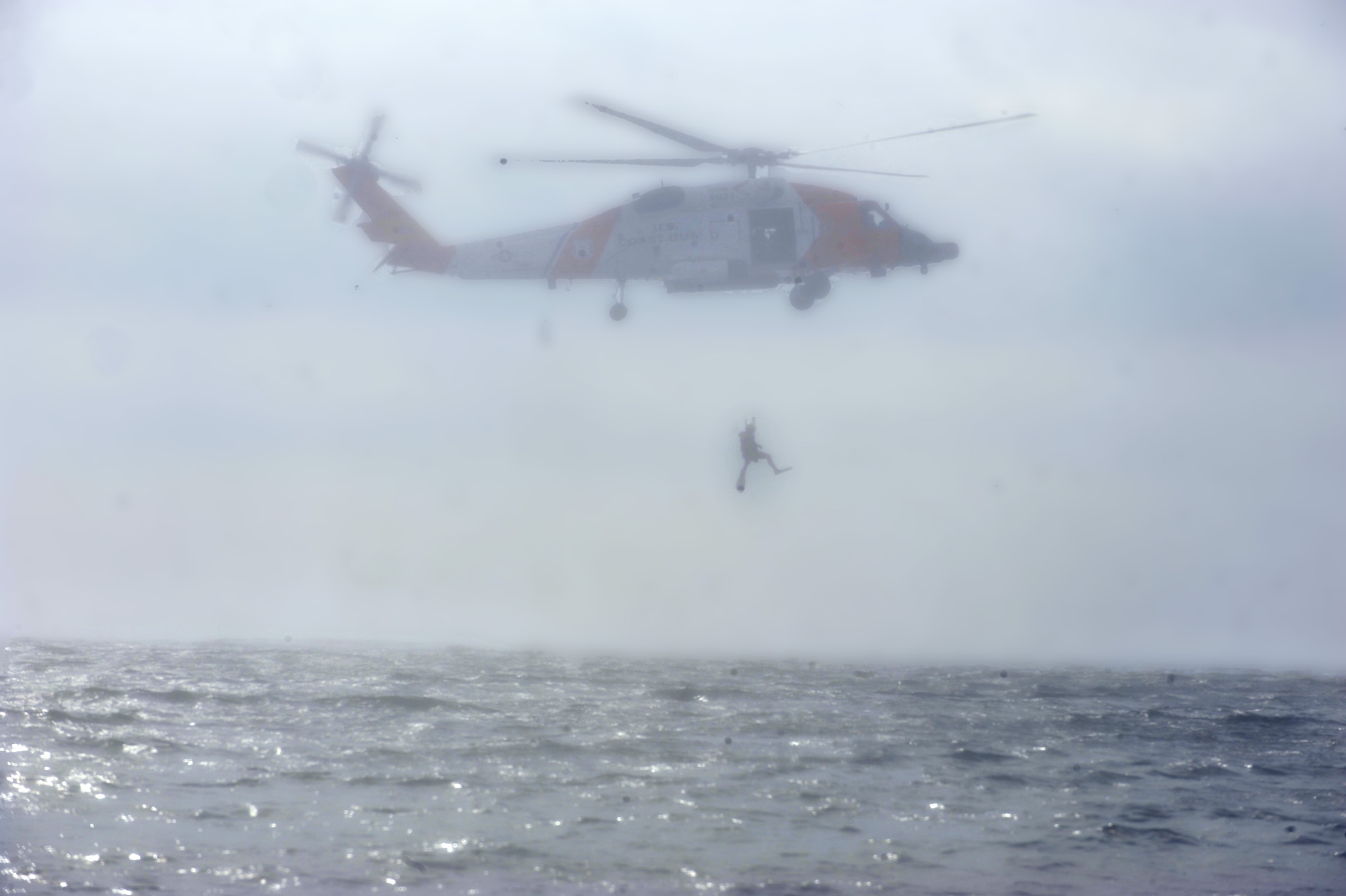 The Elizabeth City Coast Guard Air Station rescue team uses an HH-60G Pave Hawk to exercise an overwater search and rescue operation at Langley Air Force Base, Va., Sept. 22, 2011. The exercise tested processes and procedures if a pilot would have to eject over water. (U.S. Air Force photo by Staff Sgt. Antoinette Gibson/Released)