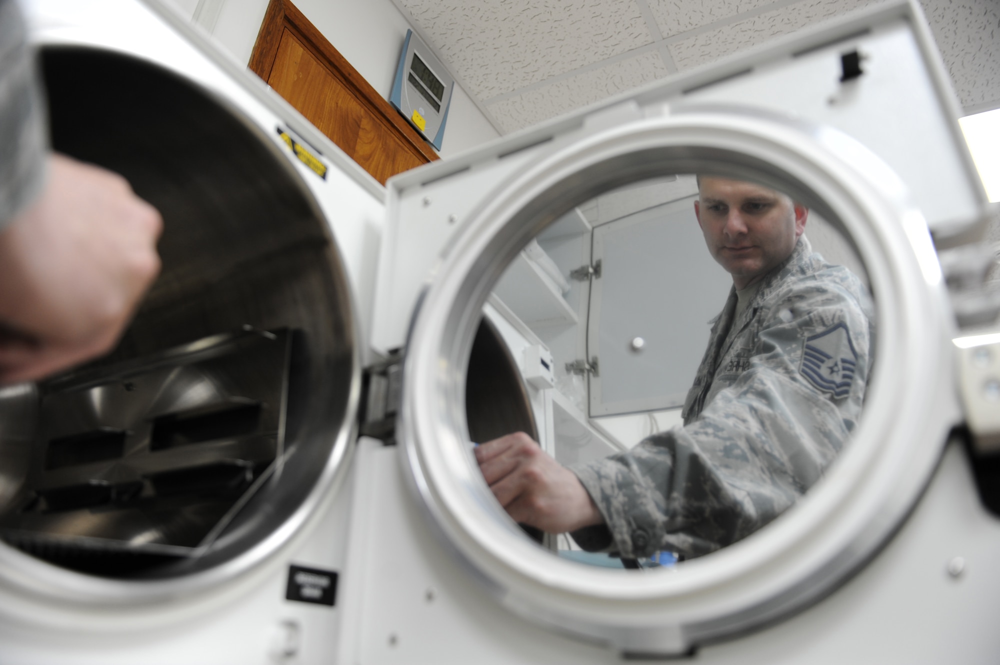 Master Sgt. S. Dwayne Shrewsbury, the NCO in charge of aerospace medicine for the 380th Expeditionary Medical Group, loads an autoclave, a machine is used to sterilize the dental equipment that kills bacteria spores, Sept. 22, 2011, at the new dental clinic at the 380th Air Expeditionary Wing in Southwest Asia. (U.S. Air Force photo/Master Sgt. Chance Babin)