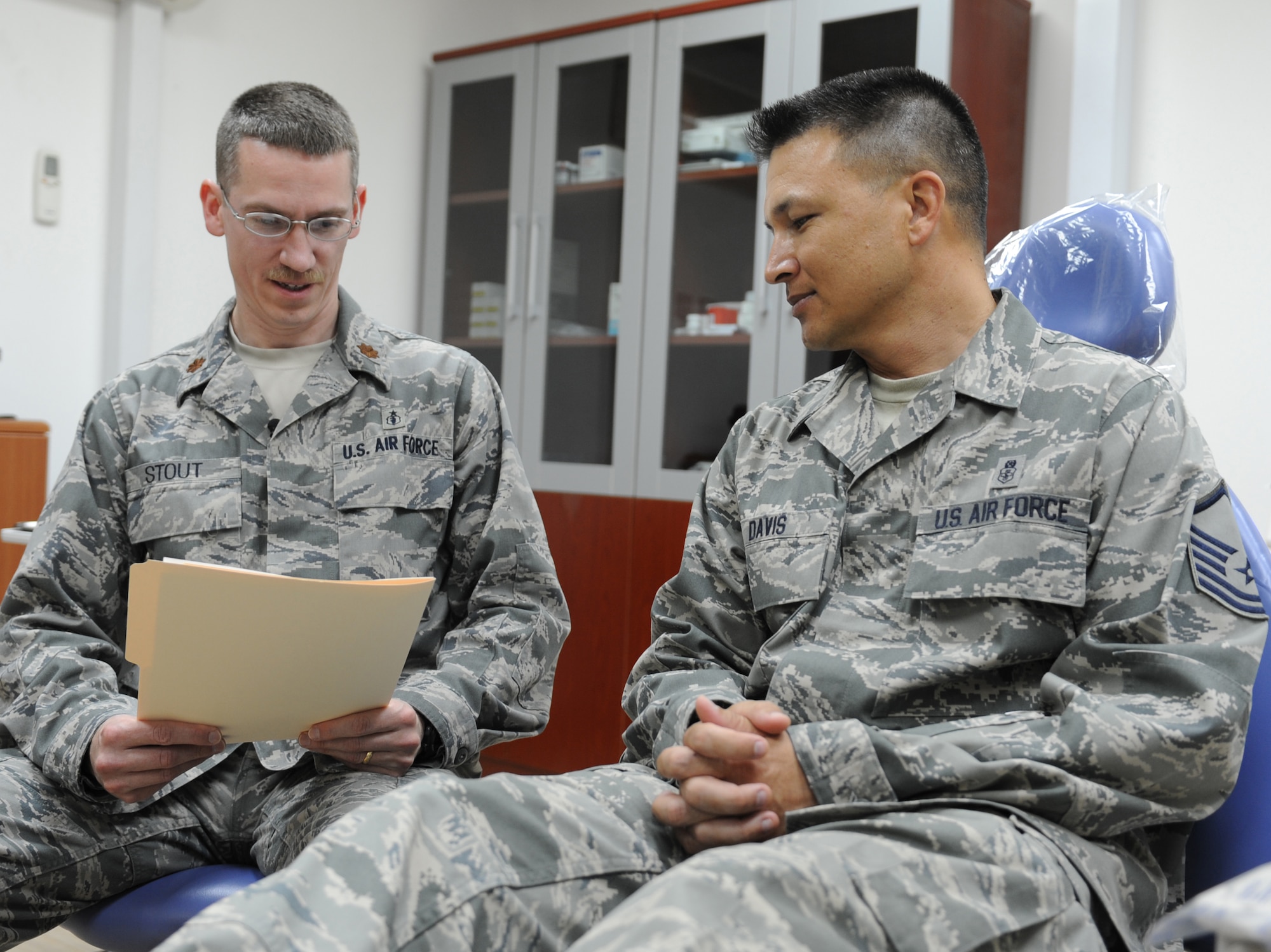 Maj. (Dr.) Bradshaw Stout, the 380th Expeditionary Medical Group dentist, conducts a patient interview, Sept. 22, 2011, at the new dental clinic at an air base in Southwest Asia. The clinic provides emergency dental care to the deployed Airmen, Soldiers and Sailors at the base, and will save the wing approximately $15,000 a month. Prior to the clinic's opening, patients were sent off base for dental care. (U.S. Air Force photo/Master Sgt. Chance Babin)