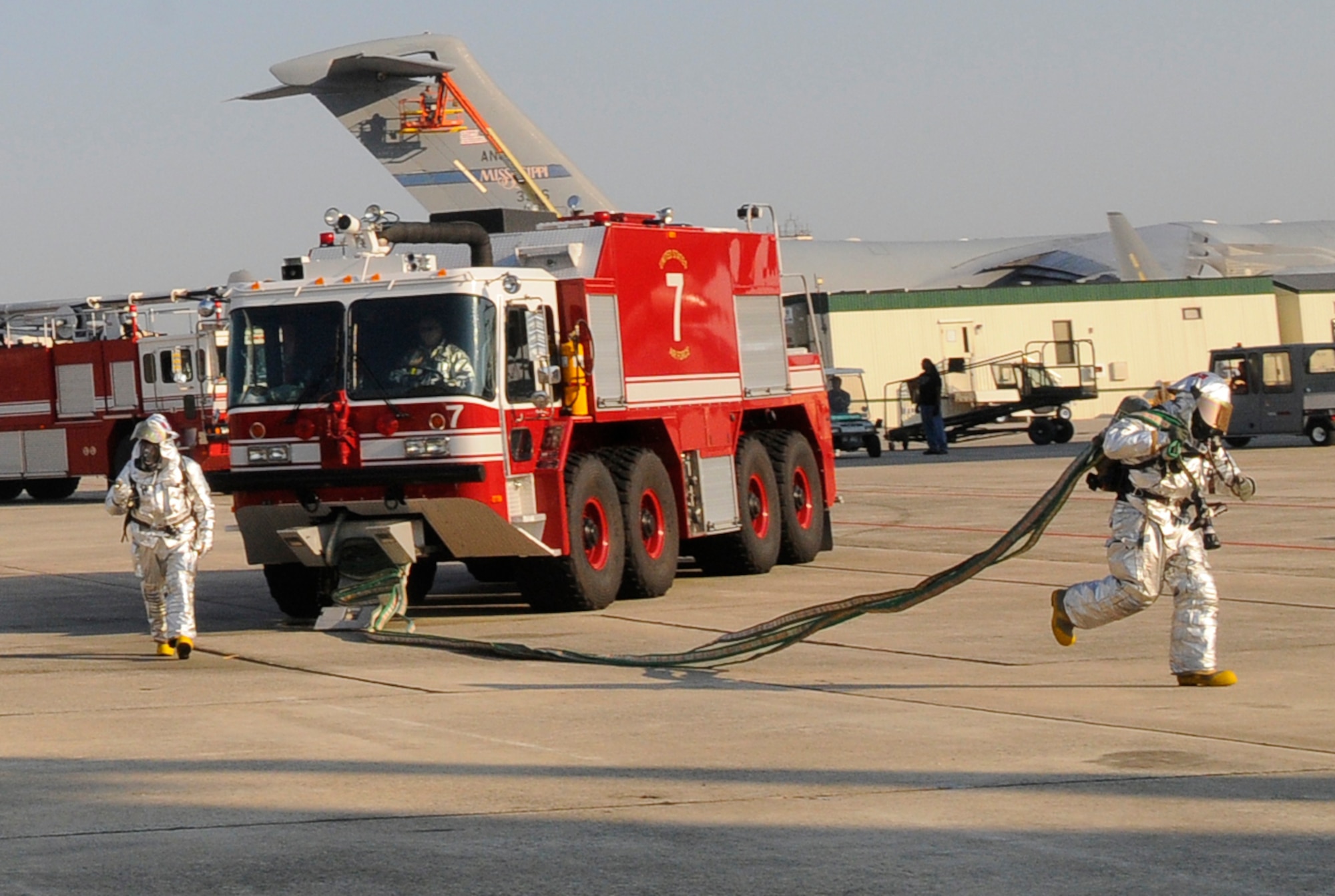 Firefighters respond during a flightline training scenario. U. S. Air Force photo by Sue Sapp