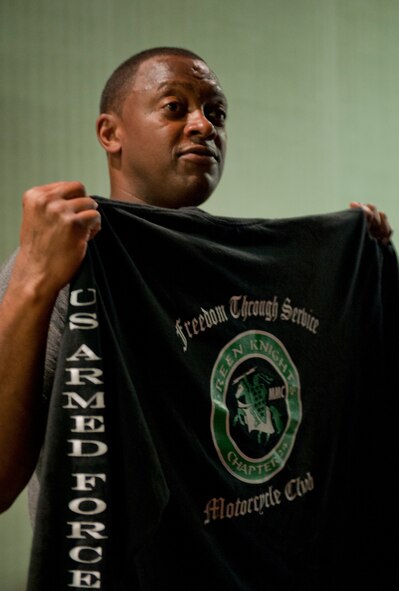 Master Sgt. Darryl Carpenter, 39th Logistics Readiness Squadron flight superintendent, shows off the Green Knights motorcycle club's official shirt Sept. 23, 2011, at Incirlik Air Base, Turkey. Currently, there are 90 chapters worldwide in the U.S. Air Force, U.S. Army, the Royal Air Force, Irish Defense Force and the Canadian Forces of Canada. (U.S. Air Force photo by Senior Airman Anthony Sanchelli/Released)