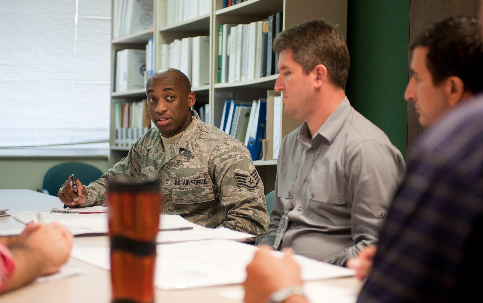 Staff Sgt. George Minkins, 39th Contracting Squadron contract administrator, meets with 39th Civil Engineer Squadron members to discuss a contract Sept. 22, 2011, at Incirlik Air Base, Turkey. The contracting squadron's primary mission is divided into the services and commodities flight and infrastructure flight. The flights prepare project packages for every contract on base. (U.S. Air Force photo by Senior Airman Clayton Lenhardt/Released)