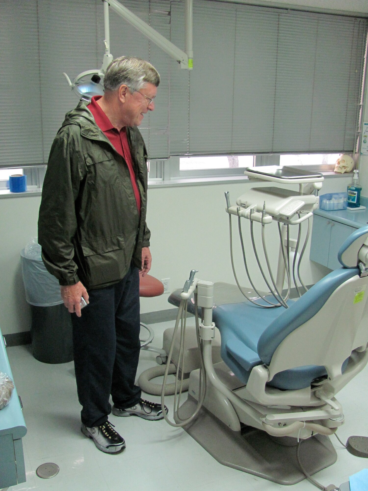 Tim Roberts examines the dental equipment in Yokota's Dental clinic, September 21, 2011. Mr. Roberts was stationed at Yokota as a dental officer from August 1973 to 1976. He and his wife, Margaret, visited Yokota recently to take a trip down memory lane. (Courtesy photo/Dr. John Treiber)