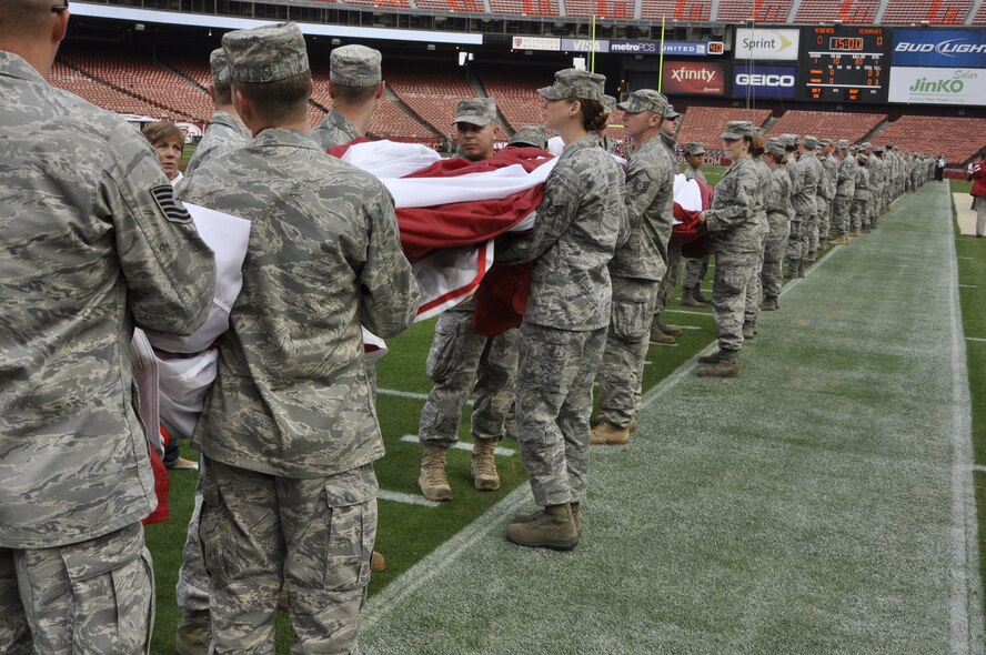 California Air National Guardsmen from the 129th Rescue Wing at Moffett Federal Airfield, Calif., teamed up with Airmen from Travis Air Force Base, in Fairfield, Calif., to participate in a flag ceremony in remembrance of the
9/11 terrorist attacks at Candlestick Park in San Francisco, Sept. 11, 2011.  Approximately 200 Airmen commemorated the tenth anniversary of 9/11 at the San Francisco 49ers 2011 season opener against the Seattle Seahawks. (Air National Guard Photo by Airman 1st Class John Pharr)
