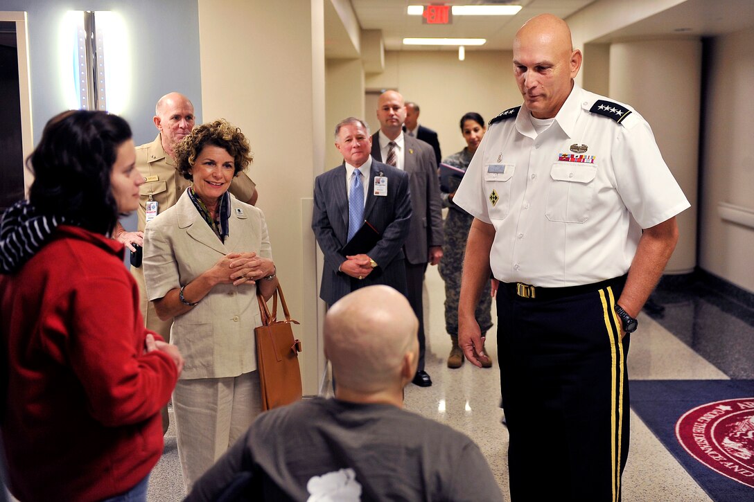 Army Chief of Staff Gen. Raymond T. Odierno and his wife, Linda, talk to a wounded warrior and his wife during a visit to the Walter Reed National Military Medical Center in Bethesda, Md., Sept. 22, 2011. 