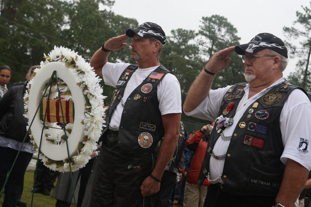 Members of Rolling Thunder Chapter NC-5 Jacksonville salute a wreath during the playing of “Taps” at the Vietnam Veterans Memorial during the 5th annual Vietnam Veterans Memorial Motorcycle Run and Rally, Sept. 24. The ceremony started with a motorcycle rally and run at the Disabled American Veterans building and ended with the names of 41 American service members who have been returned from Vietnam after the memorial was built were read, their names to be later added to the wall.