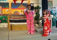 Jelasia Lanuto, daughter of Army Sgt. 1st Class Jessica Lanuto, 802nd Contracting Squadron, and Sienna Salazar, daughter of Army Sgt. Joshua Salazar, B Company, 717th Military Intelligence Battalion, get in costume Sept. 13 at the Lackland Youth Center. (U.S. Air Force photo/Robbin Cresswell)