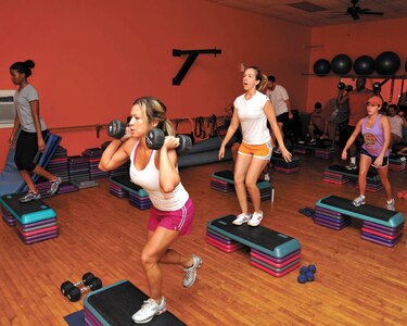 Total Body Toning instructor Nancy Talbot, front, motivates her students to work out hard Monday at the Gillum Fitness Center. (U.S. Air Force photo/Alan Boedeker)