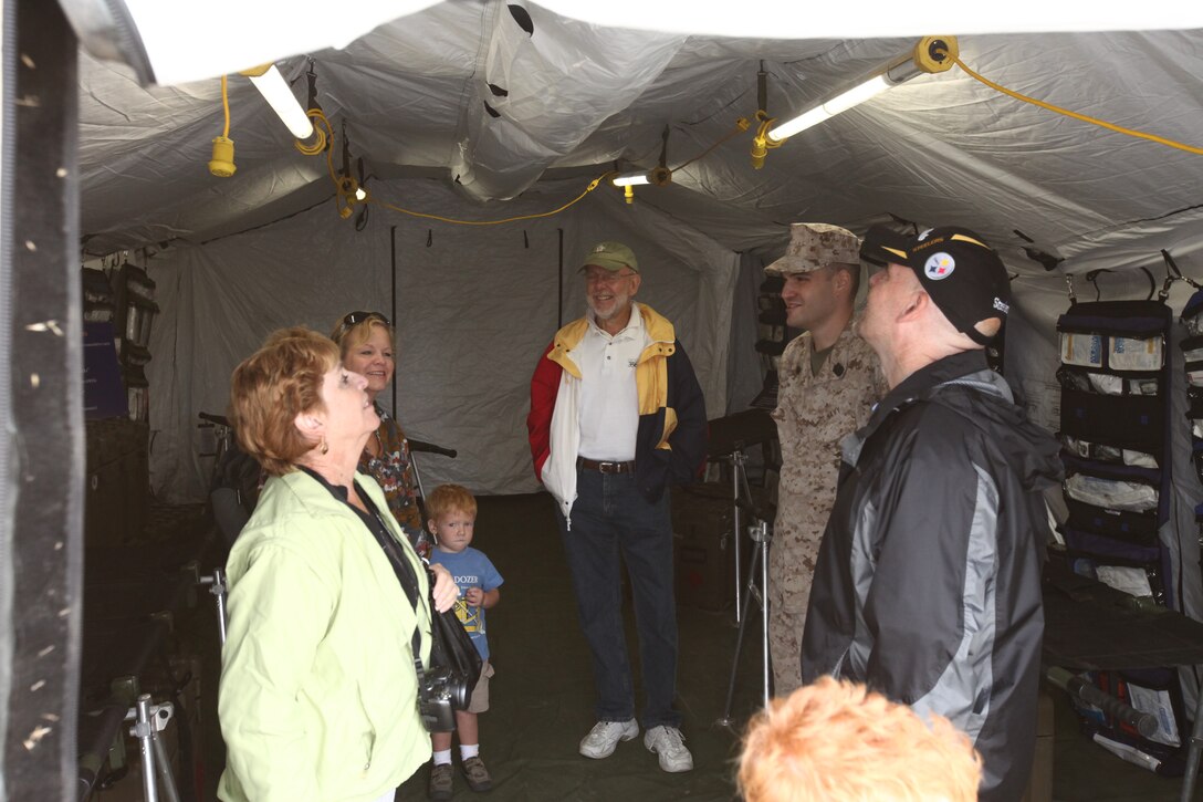 Marines and sailors with 1st Marine Logistics Group present a Forward Resuscitative Surgical Suite to the public during the Harbor Days celebration in Oceanside, Calif., Sept. 25. The FRSS is used to stabilize injured service members close to the frontlines of combat.