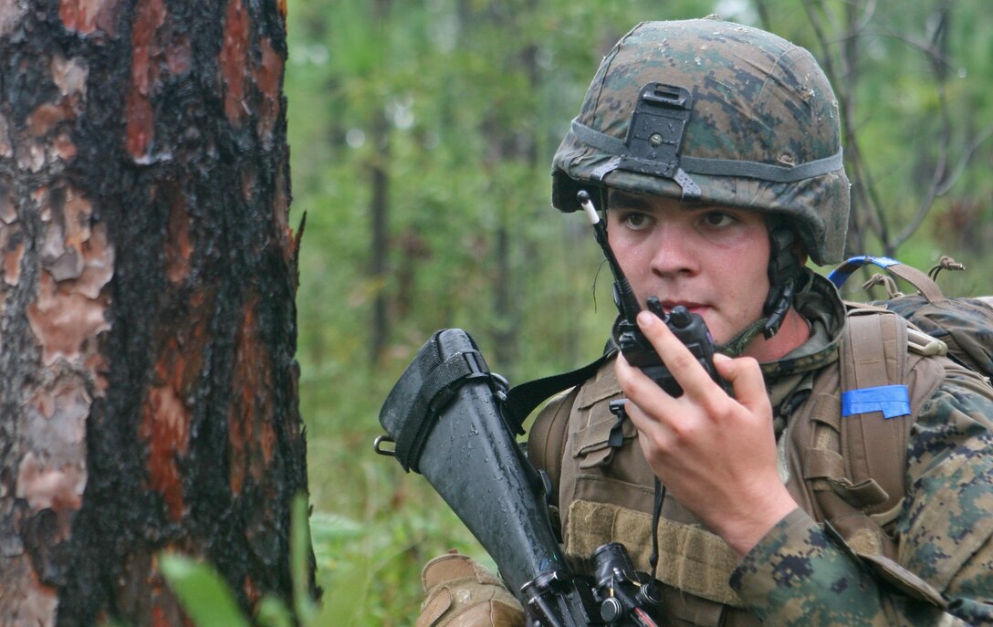 Marines with Company B, 1st Battalion, 8th Marine Regiment, 2nd Marine Division, went to combat town as part of their battalion field exercise aboard Marine Corps Base Camp Lejeune, N.C., Sept. 23-26. Lance Cpl. Casey M. McGann, team leader with the unit, radios in the situation of clearing a building held by enemy insurgents. (U.S. Marine Corps photograph by Pfc. Phillip R. Clark)