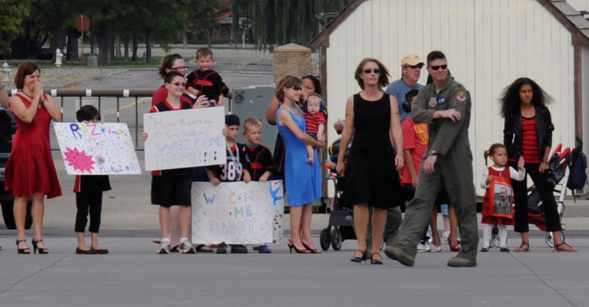 MOUNTAIN HOME AIR FORCE BASE, Idaho -- Anxious family members wait to greet members of the 389th Fighter Squadron who returned with six F-15E Strike Eagles Sept. 25. The Airmen and aircraft were deployed for six months in support of OPERATION ENDURING FREEDOM. (U.S. Air Force photo by Senior Airman Angelina Drake)