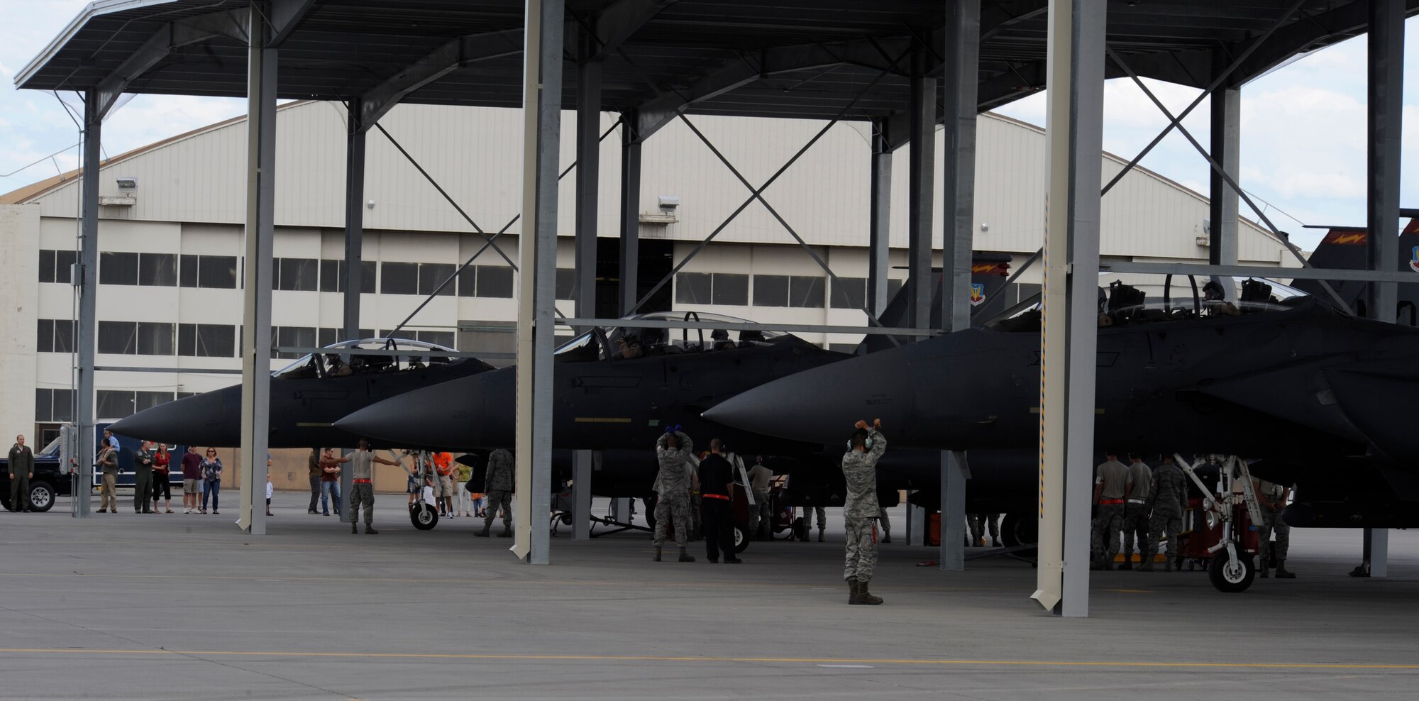 MOUNTAIN HOME AIR FORCE BASE, Idaho -- Gunfighters welcome home members of the 389th Fighter Squadron who returned with six of the squadron’s F-15 E Strike Eagles Sept 25. Families flooded the aircraft shelters to welcome home their husbands and wives as they returned from a six-month deployment. (U.S. Air Force photo by Senior Airman Angelina Drake)