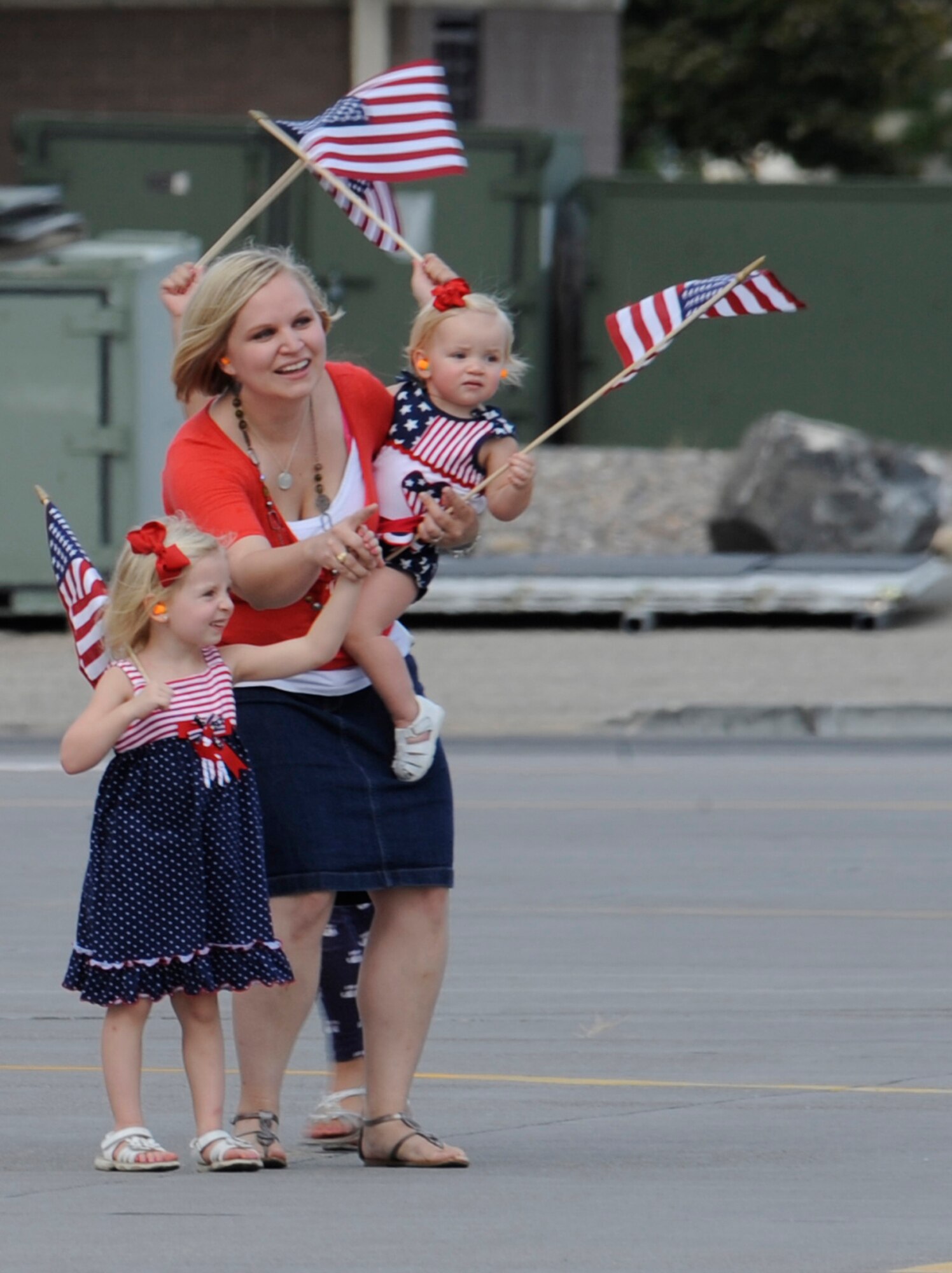 MOUNTAIN HOME AIR FORCE BASE, Idaho -- Martha Roberson points to her husband, Capt. Matthew Roberson, to her daughters after her husband lands an F-15E Strike Eagle here Sept. 25. Captain Roberson returned with several members of the 389th FS, as well as five other F-15E Strike Eagles, from a six-month deployment in support of OPERATION ENDURING FREEDOM.  (U.S. Air Force photo by Senior Airman Angelina Drake)