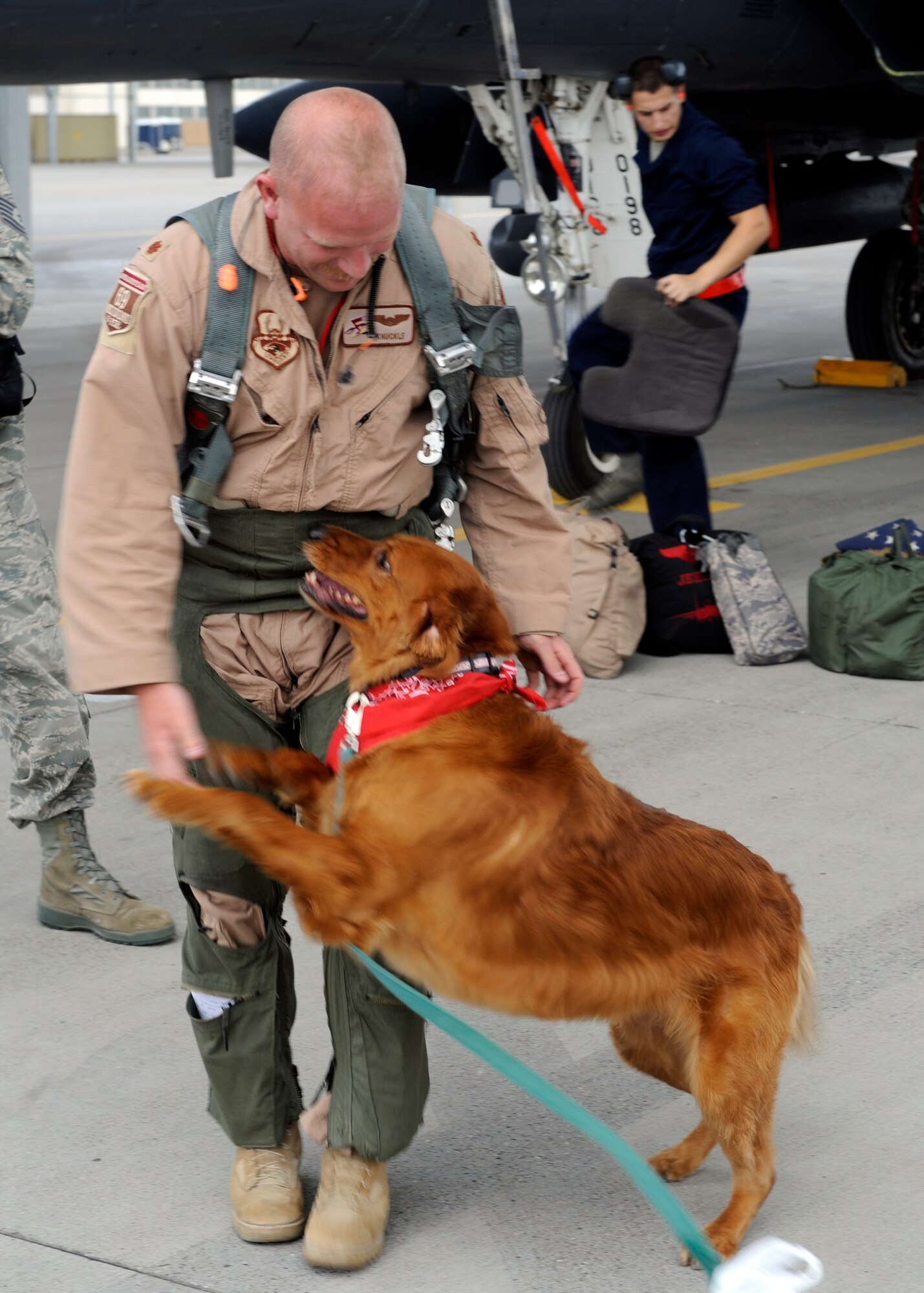 MOUNTAIN HOME AIR FORCE BASE, Idaho -- The 389th Fighter Squadron’s Maj. Cristian Murray returns from a six-month long deployment to his family -- including dog, Kady -- Sept 25. The arrival of six F-15 E Strike Eagles marks another stage in the return of the fighter squadron. (U.S. Air Force photo by Senior Airman Angelina Drake)