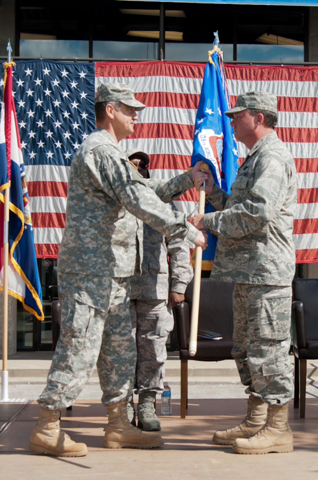 Maj. Gen. Stephen Danner, Missouri National Guard Adjutant General, gives the 139th Airlift Wing flag to Col. Michael Pankau, 139th Airlift Wing Commander Missouri Air National Guard, during the assumption of command on September 25, 2011 at Rosecrans Memorial Airport in Saint Joseph, Mo. Col. Pankau assumed command of the 139th becoming the 10th commander. (U.S. Air Force photo by Senior Airman Sheldon Thompson)