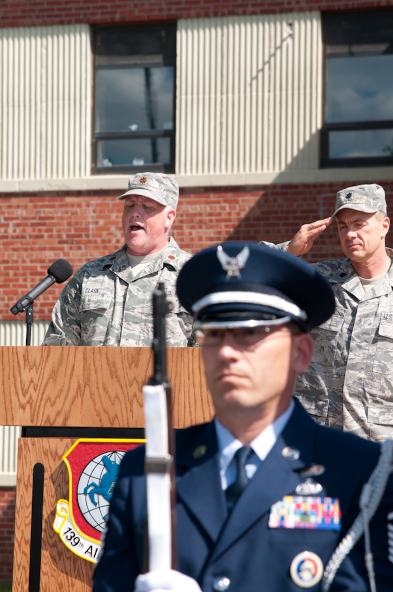 Maj. Brian Clark 139th Airlift Wing, Missouri Air National Guard, sings the National Anthem during an assumption of command ceremony on September 25, 2011 at Rosecrans Memorial Airport in Saint Joseph, Mo. Col. Michael Pankau assumed command of the 139th, becoming the 10th commander. (U.S. Air Force photo by Senior Airman Sheldon Thompson)