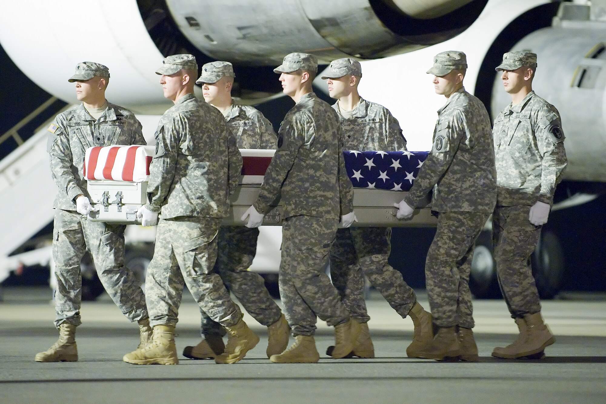 A U.S. Army carry team transfers the remains of Army Sgt. Andy C. Morales of Longwood, Fla., at Dover Air Force Base, Del., Sept. 25, 2011. Morales was assigned to the 143rd Sustainment Command (Expeditionary), Orlando, Fla. (U.S. Air Force photo/Adrian Rowan)
