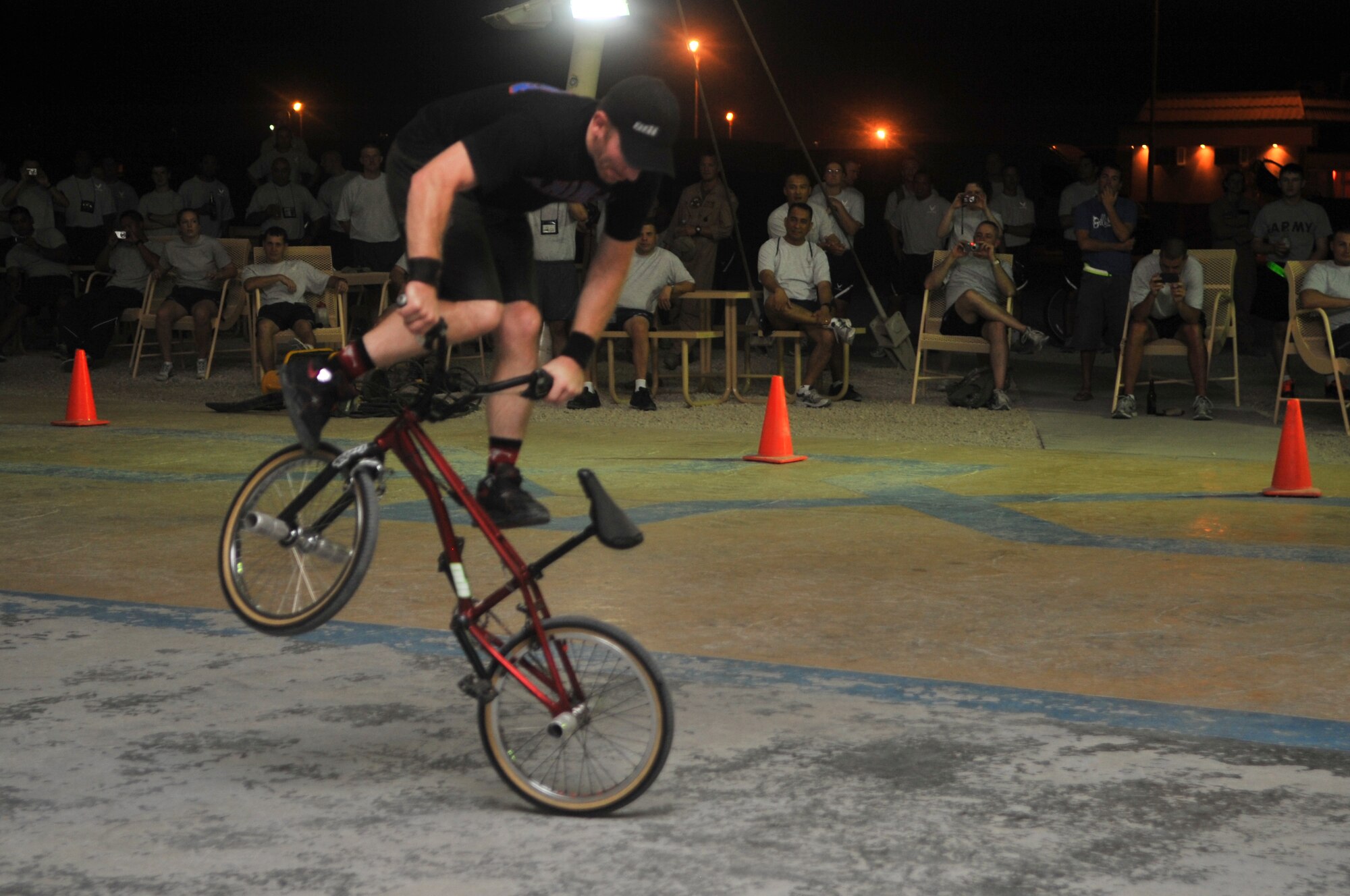 Scott Powell performs flatland tricks for deployed servicemembers during the “Bikes over Baghdad” tour, Sept. 24, 2011, at an undisclosed location in Southwest Asia. (U.S. Air Force photo/Senior Airman Paul Labbe)